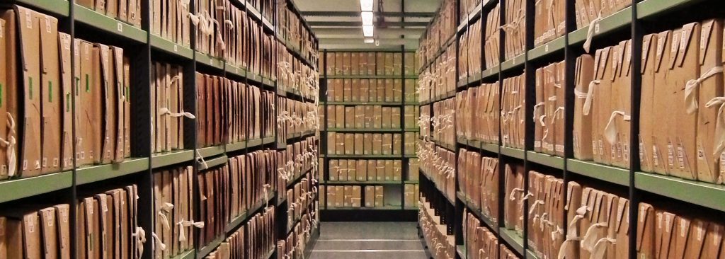 A-corridor-of-files-at-The-National-Archives-UK-1-1024x366-1024x366.jpg