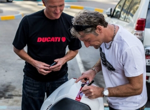 A 'legend' signs the  bike